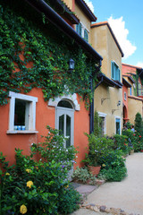Fototapeta na wymiar italy style building in beautiful garden and blue sky