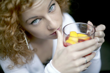 Girl drinking fruit tea