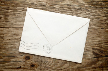 Old envelope on wooden background