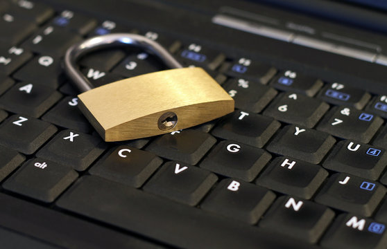 Encrypted - Padlock on laptop keyboard