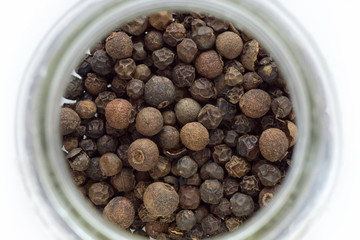 isolated dried pepper in a jar