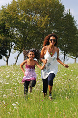 Fototapeta premium mother and daughter running