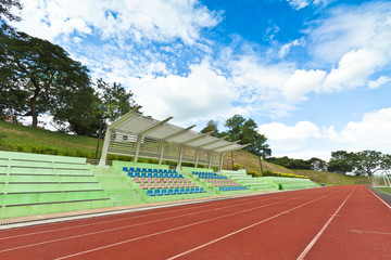 Stadium chairs and running track in a sports ground