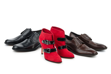Male and female shoes on white