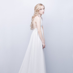 Fototapeta na wymiar portrait of beautiful elegant blond woman in white dress