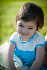 A little girl in a summer park