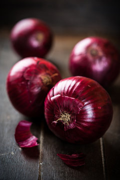 Red Onions on Wooden Background