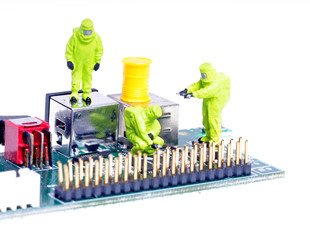 tiny figures of chemical team examining integrated circuit