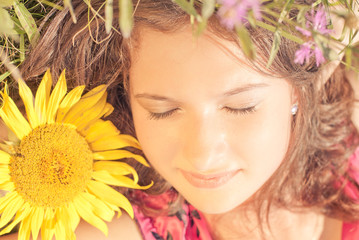 Girl sleeping  among flowers