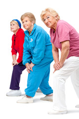Senior women streching legs.