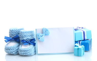 beautiful gifts, baby's bootees and blank postcard, isolated
