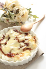 Japanese cuisine, demi-glance sauce on rice with cheese on top