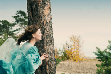 girl in medieval dress. strong wind