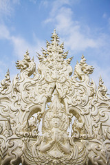 Fototapeta na wymiar white temple decoration, white magnificent temple in Thailand.
