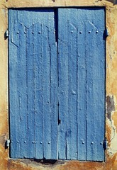 Old blue window shutters.