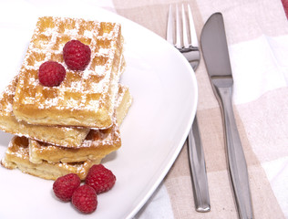 Fresh waffles with raspberries