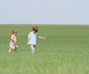 happy children playing on natural background