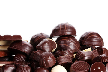 Many different chocolate candy isolated on white