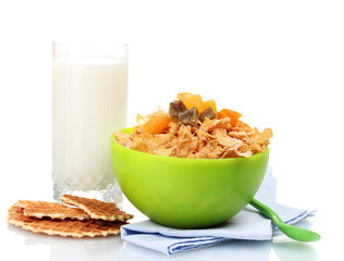 tasty cornflakes in green bowl and glass of milk isolated