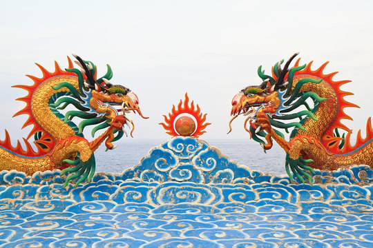 Two chinese dragon statue on the clouds.