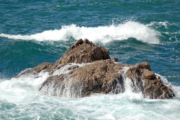 Storm in sea, beside the wild rock