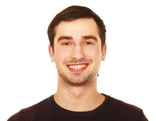 Obraz premium Closeup portrait of a young smiling guy, isolated on white