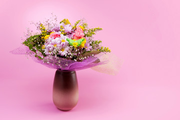bunch of flowers on pink background