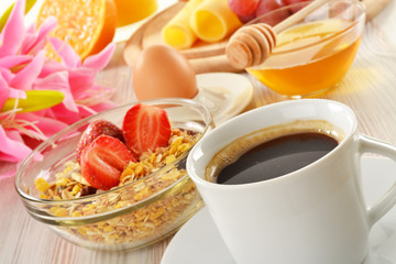 Breakfast with coffee, rolls, egg, orange juice, muesli & cheese
