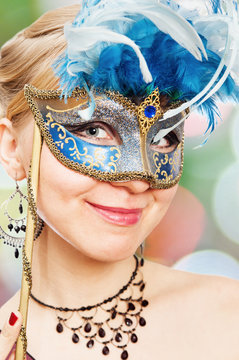 young woman in Carnival mask