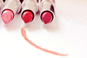 set of aligned lipsticks with red stroke