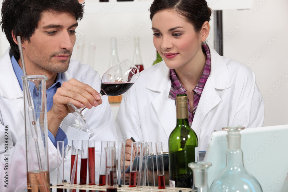 Wall mural couple in a wine laboratory