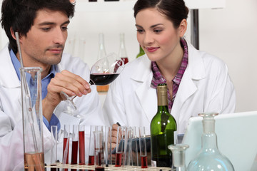 Couple in a wine laboratory