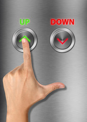 Fototapeta premium Human hand pressing up button on metalic background