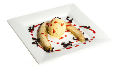 Bake banana with vanilla ice cream and caramel syrup; isolated o