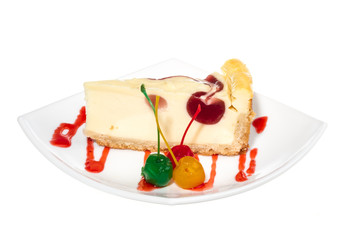 Closeup of a slice of cherry cheesecake on a white background