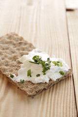 Whole grain bread with curd and chives