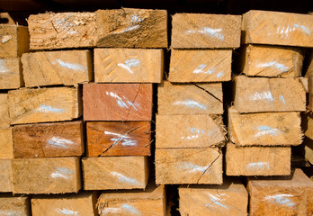 stack of lumber in timber logs storage