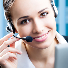 Happy smiling support phone operator at office