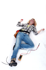 Female electrician suffering an electric shock
