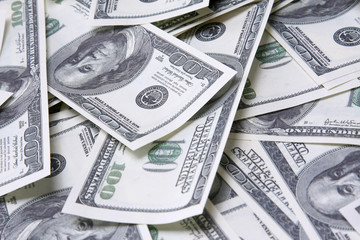 a background with american one hundred dollars