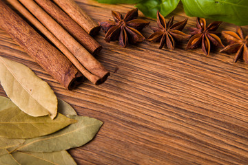 Frame composition of spices on wood,anise,cinnamon,laurel