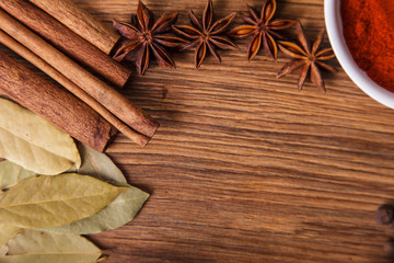 Frame composition of spices on wood,anise,cinnamon,laurel