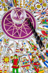 Tarot cards in circle with a magic ball and wand in the center