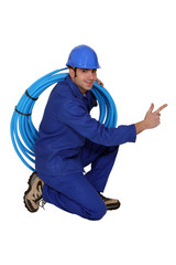 Happy plumber, studio shot