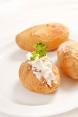 Baked potato filled with soft cheese