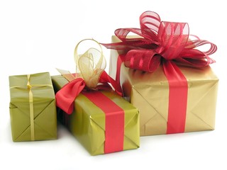 Christmas gift in gold paper with red ribbon