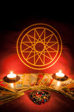 Tarot cards illuminated by candlelight.