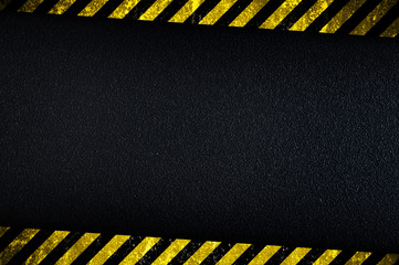 Dark background with yellow caution stripes - 40965272