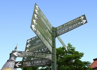 Crossroad sign in Hungarian in the middle of Eger