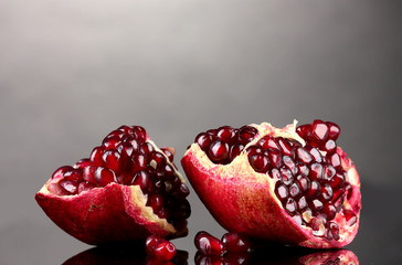ripe pomegranate fruit on grey background